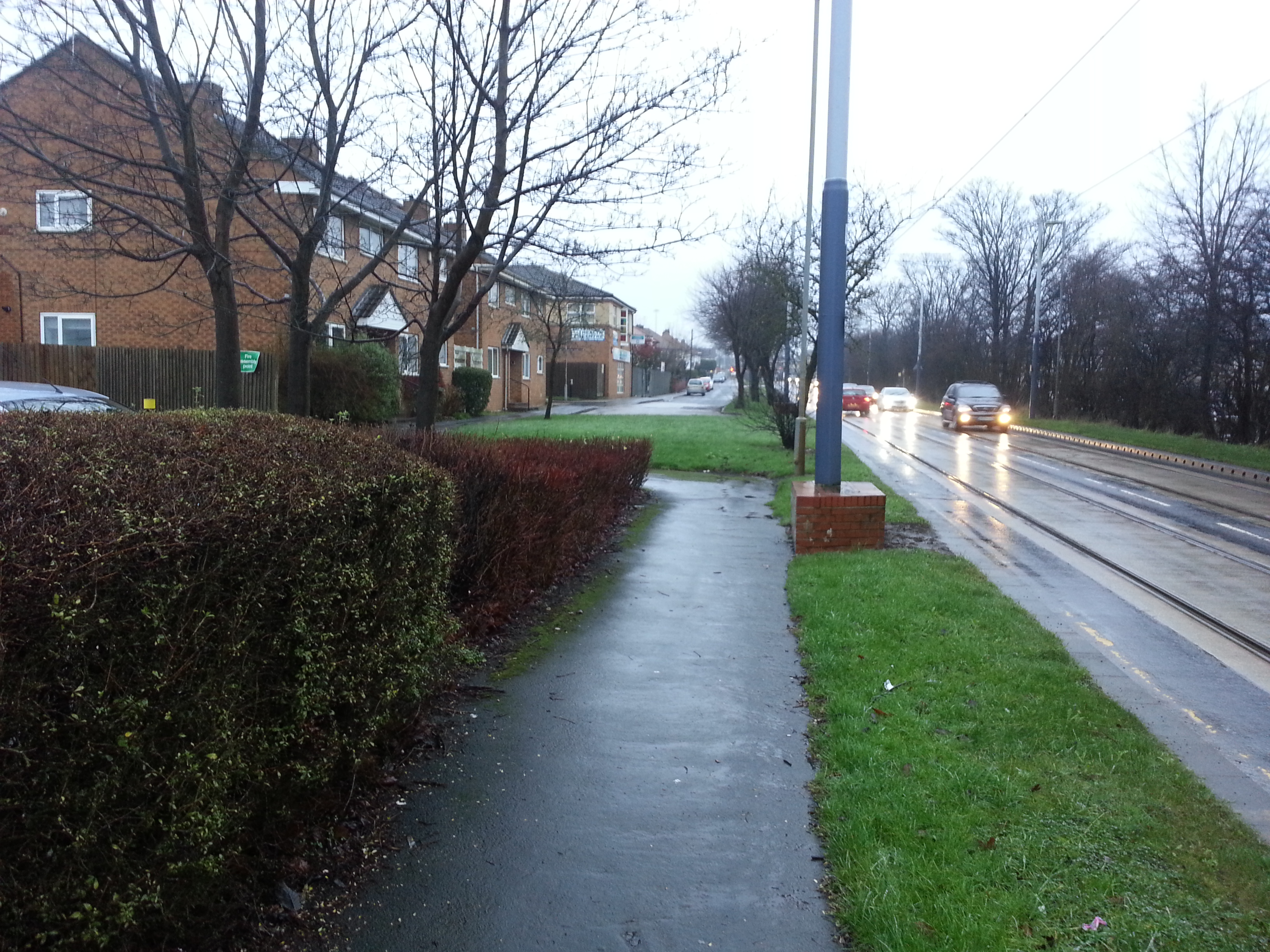 Service roads like this should be designed to support cycling parallel to the tram lines as is normal in The Netherlands.
